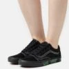 Vans Old Skool Unisex - Trainers - Blackout -Vans Shop UK 72ad62953d274615b14dbe9e2dcd4c72